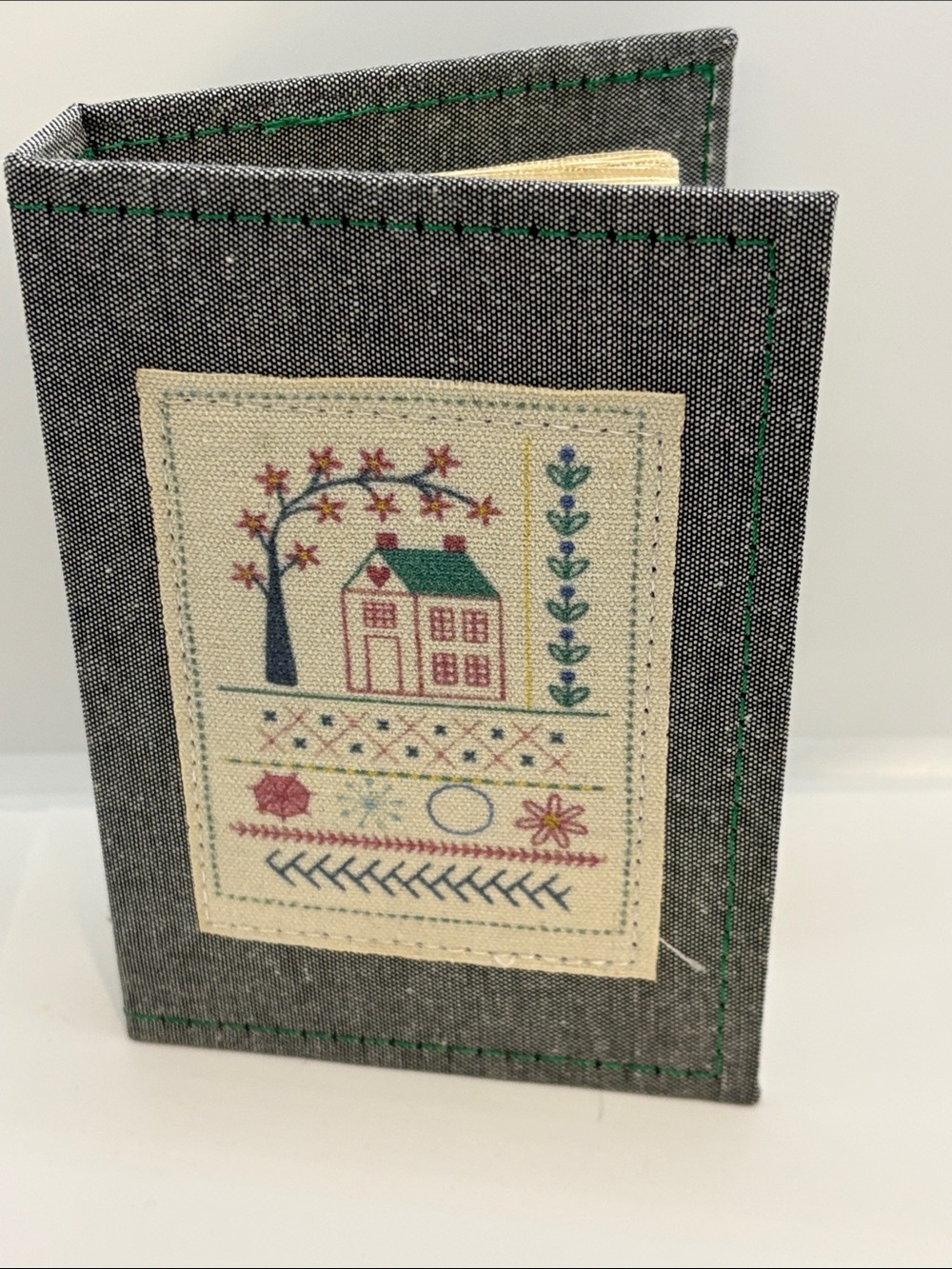 Sampler book of embroidery stitches, cottagecore country, sewing needle point